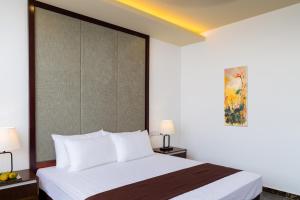 Kama o mga kama sa kuwarto sa Jie Jie Beach Hotel