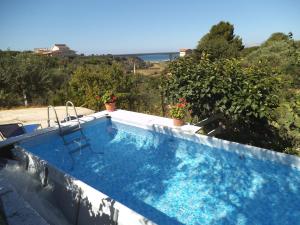 a swimming pool with a view of the ocean at Valle Verde 3 Clima & Wi-Fi in Castellammare del Golfo