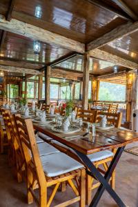 a large wooden table and chairs in a room at Dar l'eau Vive in Bine el Ouidane
