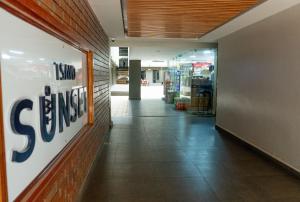 a store hallway with a store sign on the wall at Stylish 10th Floor Studio with great Views ,Fast Wi-Fi and Secure in Nairobi