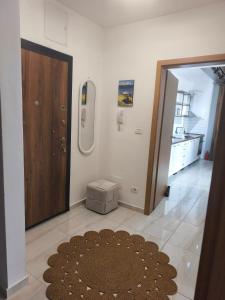 a room with a door and a rug on the floor at Ana VS Apartment in Ohrid +10 photos