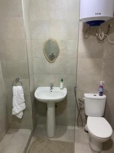 a bathroom with a toilet and a sink at Rabat Easy Access ll in Rabat