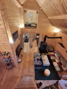 an overhead view of a living room in a log cabin at The Sam's house in Panouryiás