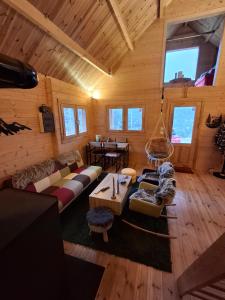 an overhead view of a living room in a log cabin at The Sam's house in Panouryiás