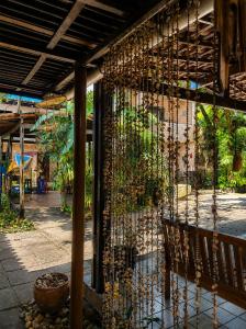 a building with a fence with plants on it at Hotel Pousada Casuarinas in Recife +8 photos