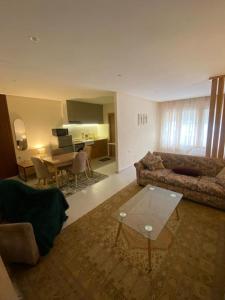 a living room with a couch and a table at Rabat Easy Access ll in Rabat