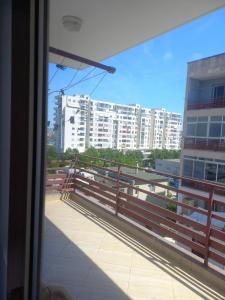 a view from a window of a balcony with buildings at Flodril Appartment in Durrës