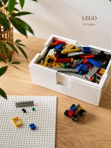 a toy box filled with lego toys on a table at Grand Reve KODEKI Near Nagoya Dome in Yadachō +41 photos