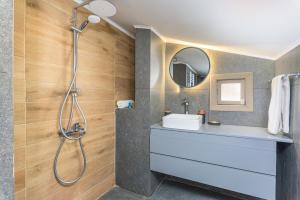 a bathroom with a sink and a shower at Maison Montagne Mzaar in Kfardebian +81 photos