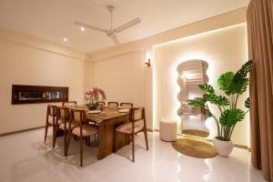 a dining room with a table and chairs at 79 by TerraLume in Nugegoda