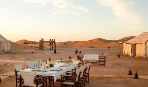 a long table in the middle of the desert at Camping nature in Jeradat
