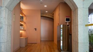 an empty hallway with a door in a building at Hotel Margarida Da Praça in Viana do Castelo