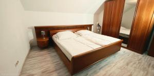 a bedroom with a bed and a large mirror at Ferienhaus am Doctorberg in Bernkastel-Kues