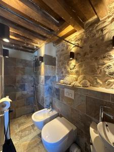 a bathroom with two toilets and a sink at MAISON LA TRANQUILITÉ by Frans & Ricardo in Saint-Didier-sur-Arroux +27 photos