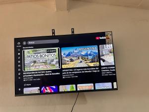 a flat screen tv hanging on a wall at El Descanso APART in Libertador General San Martín