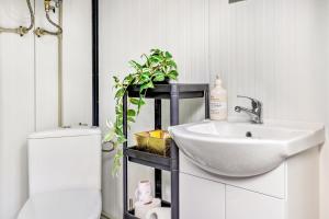 a bathroom with a sink and a toilet at La Pura Vida - Glamping in Brandenburg an der Havel +45 photos