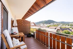 a balcony with a view of a city at Hofquartier in Kappelrodeck
