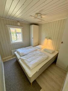 a bedroom with a large bed in a room at Brissundsbyn in Visby
