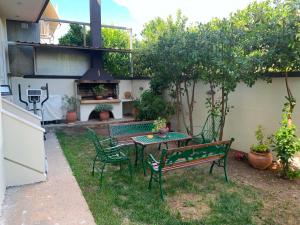 a patio with a table and chairs in a yard at The Spartan Horizon in Sparta