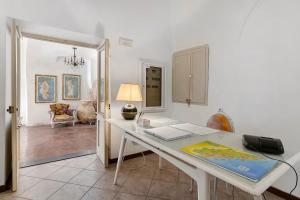 a white desk with a phone on it in a room at Al Castello Residenza D'Epoca in Pietra Ligure
