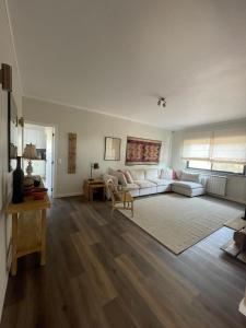 a living room with a couch and a table at Monte da Fonte in Odemira