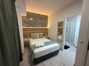a bedroom with a bed with two pillows on it at Hotel Boutique Traveler 360 in Madrid +29 photos