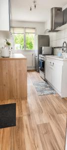 a kitchen with a sink and a counter top at Le petit paradis in Abbeville