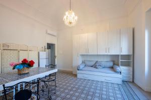 a living room with a couch and a table at Chez Moi in Trapani