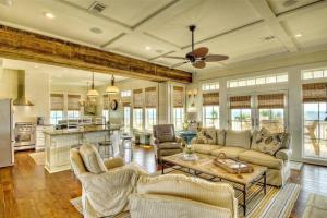 a living room with a couch and a table at Moss Landing Luxury Beachfront Private Walkover in Bolivar Peninsula