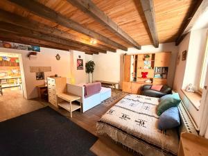 a living room with a couch and a table at Dharma Farm Retreat in Mijoux