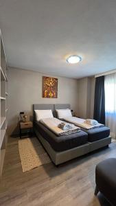 a bedroom with two beds in a room at Casa Marika in Valdisotto