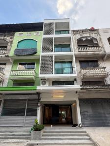 a large building with stairs in front of it at 2 Bed & 2 Bath Suite, 4th floor in Ban Bang Toei (1)