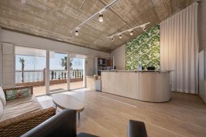 an office lobby with a reception desk and a table at Spacious 3 bedrooms apartment side sea view in Torrox Costa