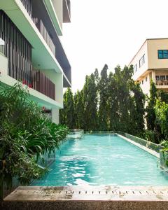 a swimming pool in the middle of a building at Solaris Executive Suites Osu Pool Gym in Accra