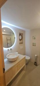 a bathroom with a sink and a toilet at Villa Mirella in Jávea +30 photos