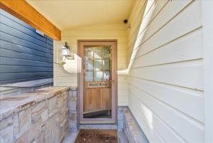 a door on the side of a house at Cozy Hillside Cottage Overlooking Main Street in Park City