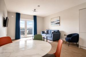 a living room with a table and chairs at The Maltings in Portlaoise