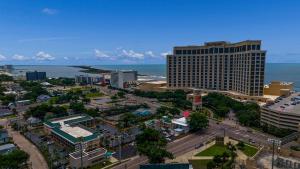 an aerial view of a city with a tall building at Hotel Biloxi in Biloxi +33 photos