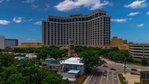 a large building with a parking lot in front of it at Hotel Biloxi in Biloxi