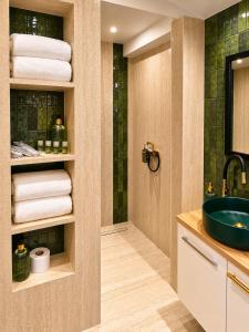 a bathroom with a sink and a shower at Apartmán na Rohu II in Malacky