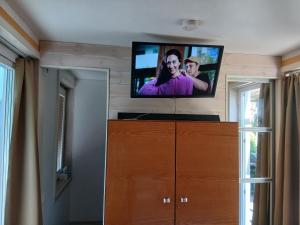 a flat screen tv on the wall of a room at Forrent-ee in Pärnu