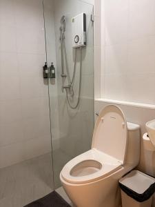 a bathroom with a shower and a toilet at 2 Bed & 2 Bath Suite, 5th floor in Ban Bang Toei (1) +26 photos