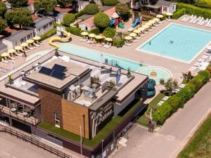an aerial view of a resort with a swimming pool at Club del Sole Le Palme Lazise Family Collection in Lazise