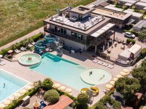 an aerial view of a resort with a swimming pool at Club del Sole Le Palme Lazise Family Collection in Lazise