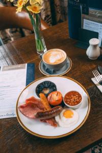 a plate of breakfast food on a table at The George Hotel in Penrith