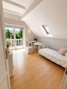 a living room with a couch and a table at Prestige Garden Villa - Cracow in Krakow