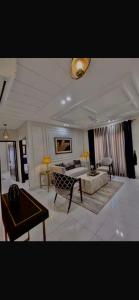 a large living room with a bed and a table at Global properties in Faisalabad