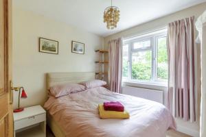a bedroom with a bed and a window at 4 Bed in Ilkley oc-ds168 in Ilkley