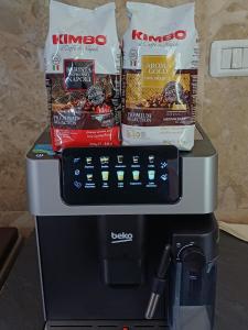 a coffee machine with snacks on top of it at Vila Danida in Žabljak +38 photos