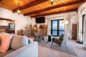 a living room with a couch and chairs at Galeb Bed and Breakfast in Baćina